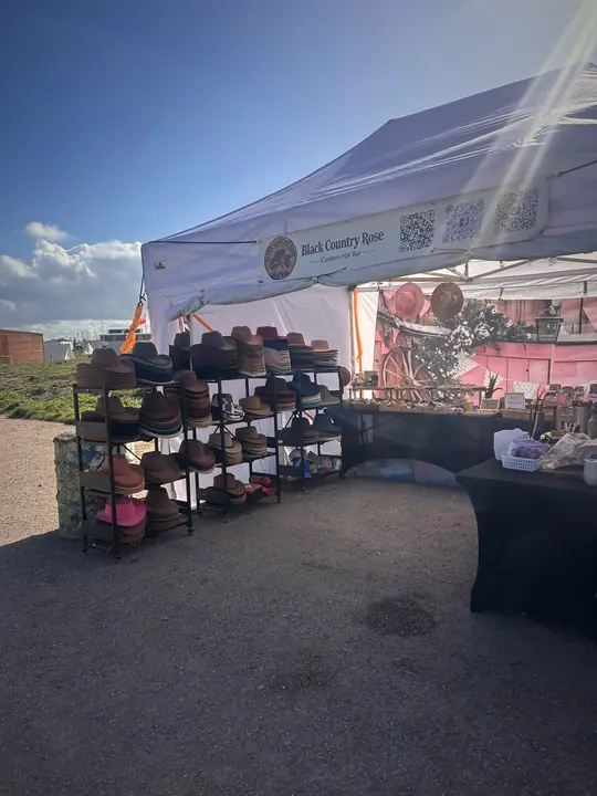 The Black Country Rose gazebo and hat racks in the sunshine at an event