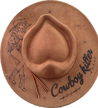 Tan heart-crown hat with a pin-up cowgirl, stars, barbed wire and “Cowboy Killer” burned into the brim
