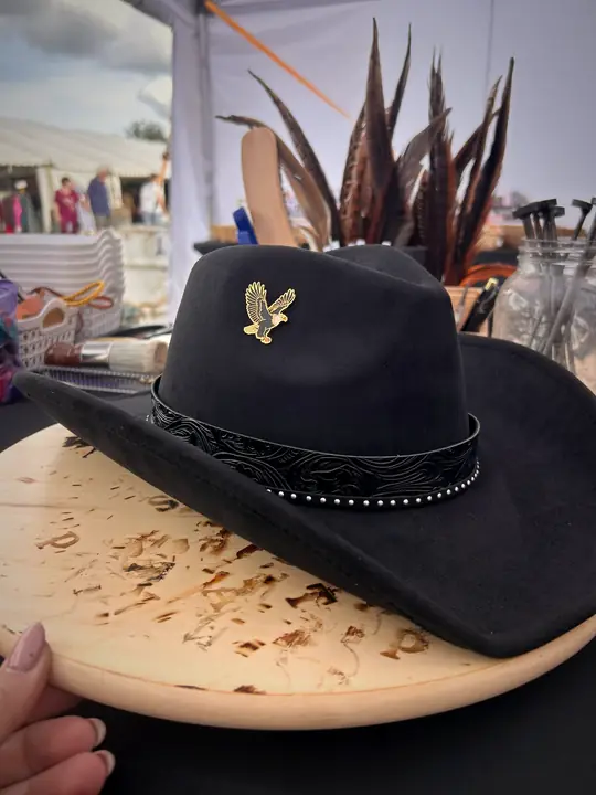 Black hat with eagle pin and studded band