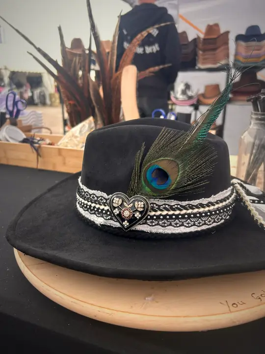 Black hat with lace band, heart charm and peacock feather