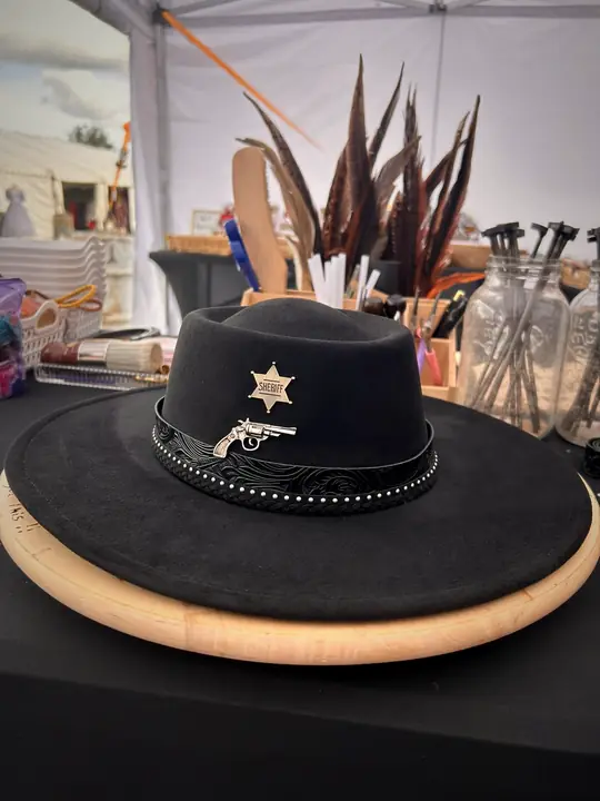 Black hat with sheriff star and pistol pin