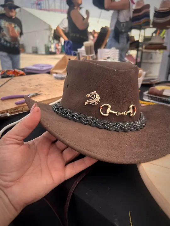 Brown hat with braided band and horse bit