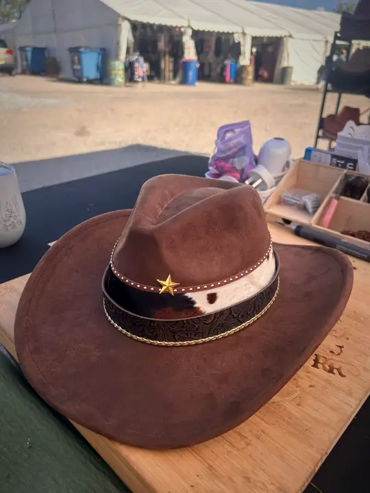 Brown hat with cowhide band and gold star