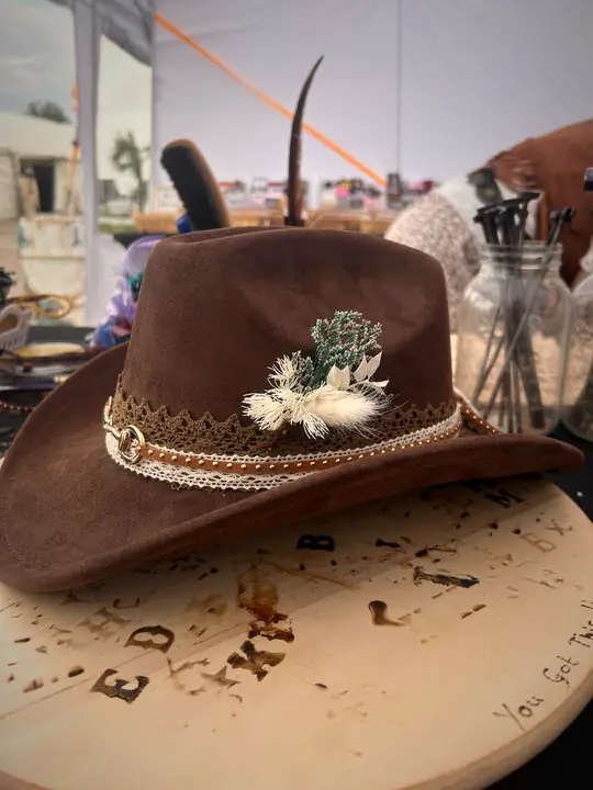 Brown hat with lace band and dried flowers